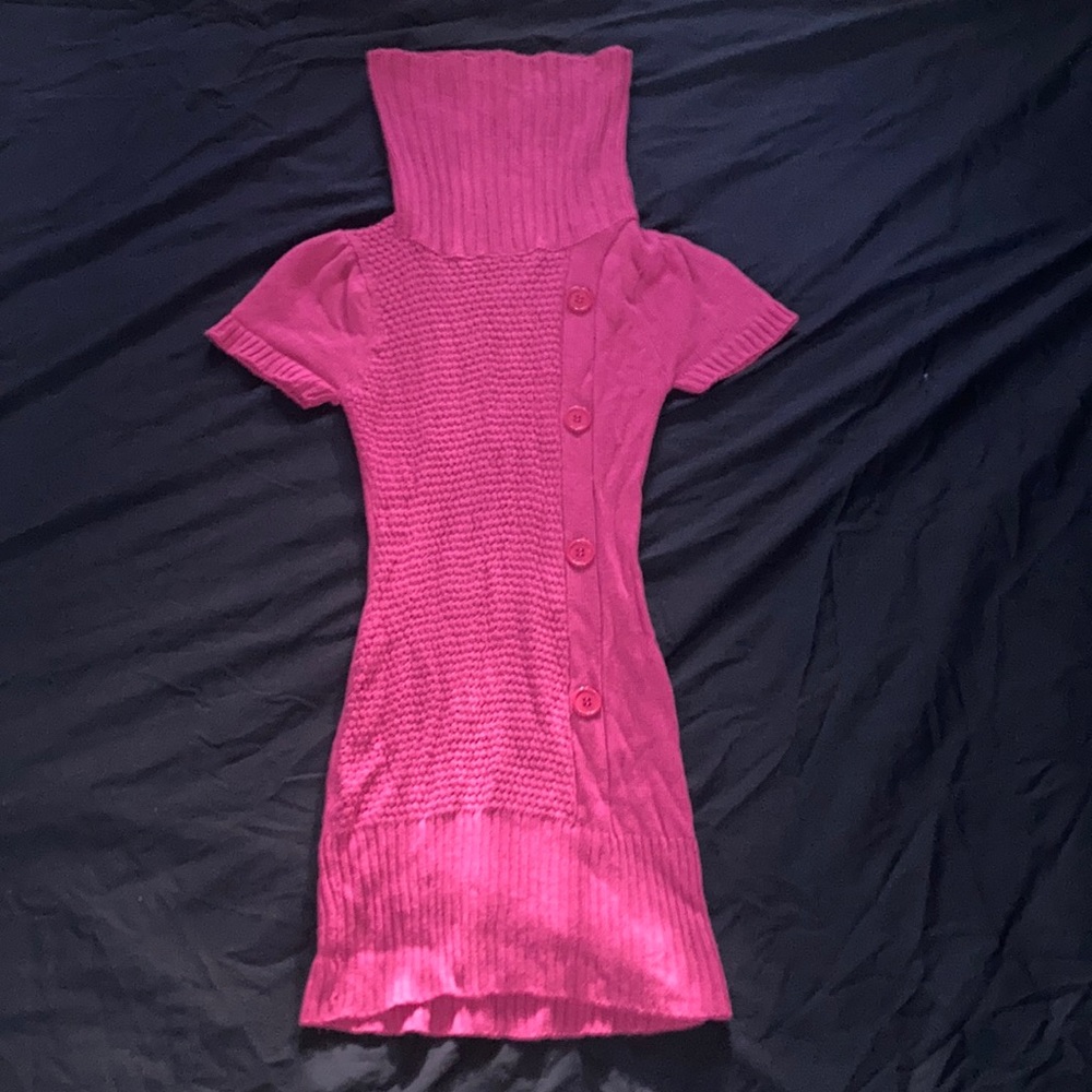 A pink turtleneck.